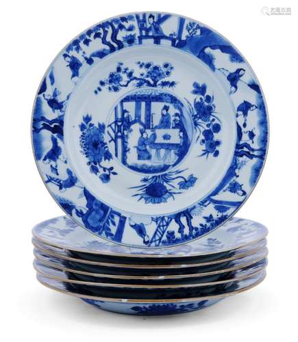 Six blue and white plates with a brown trimmed edge