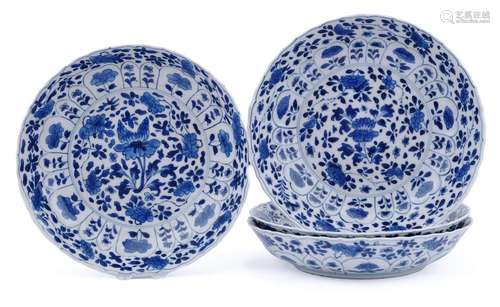 Four blue and white floral plates