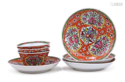 An unusual patterned set of famille rose cups and saucers