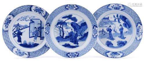 Three blue and white plates with figures