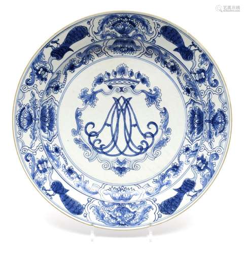 A large blue and white charger with crowned monogram