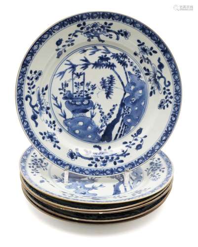 Six large blue and white plates