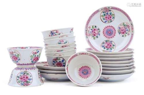 A set of famille rose cups and saucers