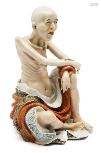 A porcelain figure of Buddha