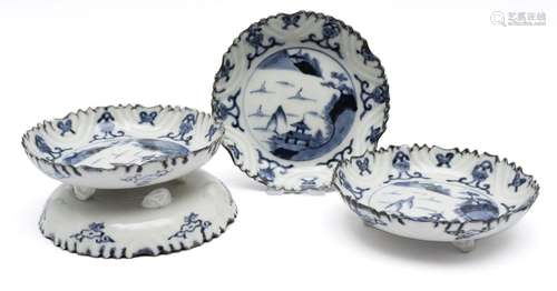 Four blue and white tripod dishes