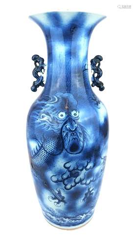 A large blue and white dragon vase