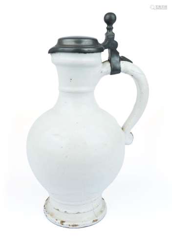 A Delft white pottery pitcher with pewter lid
