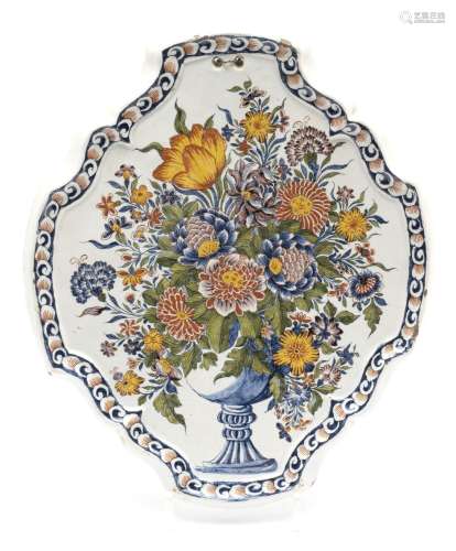 A large Delft polychrome pottery floral wall plaque