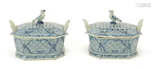 A pair of Dutch Delft blue and white butter dishes with bird...