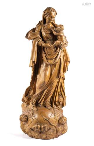 A Flemish carved limewood figure of the Virgin and Child ato...