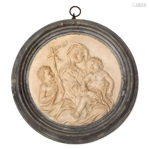 A North-European carved marble tondo of the Virgin and Child...