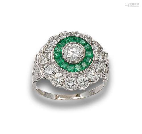 PARTRIDGE`S EYE RING WITH DIAMONDS, EMERALDS AND PLATINUM