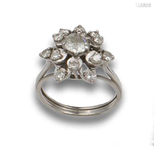 ANTIQUE FLOWER RING WITH DIAMONDS AND PLATINUM