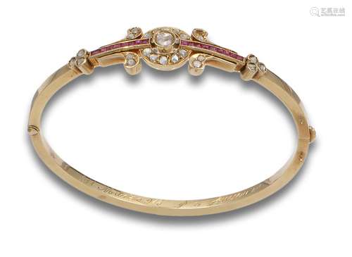 RIGID BRACELET, 1940s, IN GOLD, DIAMANTIES AND SYNTHETIC RUB...