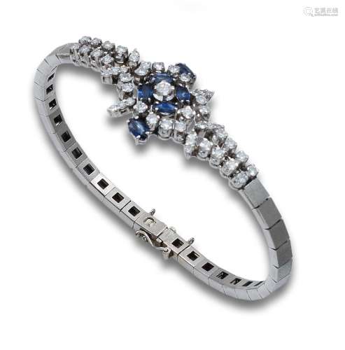 WRIST. 70 YEARS, OF DIAMONDS, SAPPHIRES AND WHITE GOLD