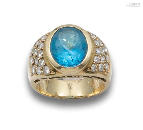 YELLOW GOLD RING WITH CENTRAL BLUE TOPAZ AND DIAMONDS