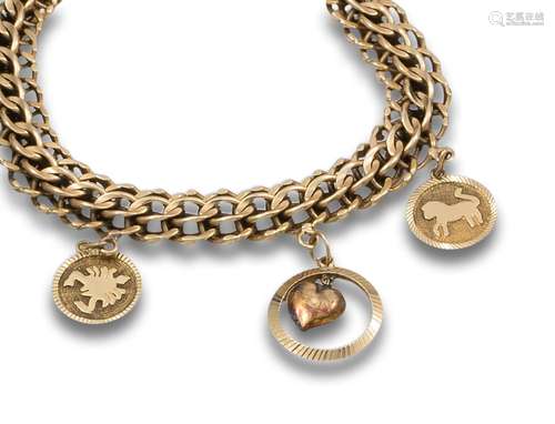 BRACELET, 1950s, YELLOW GOLD WITH PENDANT CHARMS