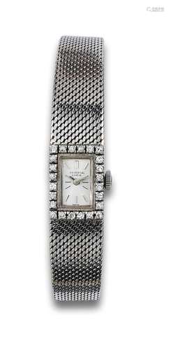 UNIVERSAL GENEVE LADIES WRISTWATCH, IN WHITE GOLD AND DIAMON...