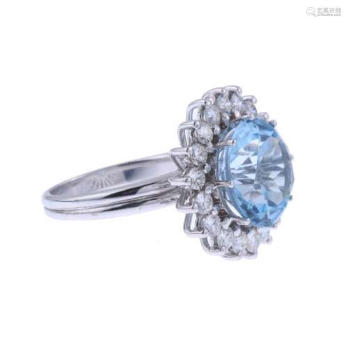 ROSETTE RING WITH BLUE TOPAZ AND DIAMONDS.