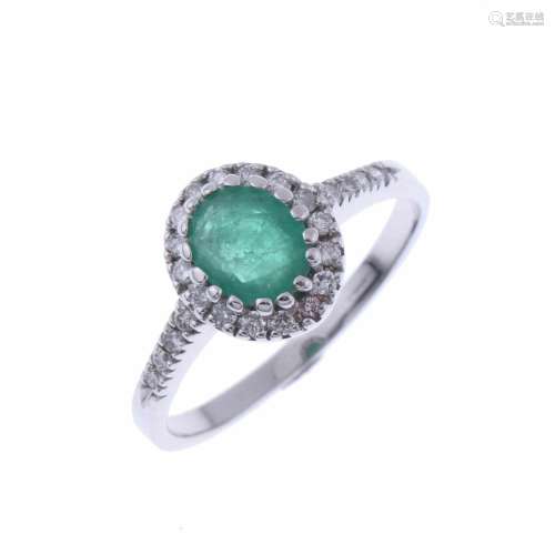 ROSETTE RING WITH EMERALD AND DIAMONDS.