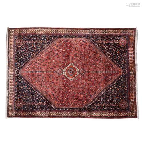 IRANIAN CARPET IN RED TONES AND FLORAL DECORATION, 20TH CENT...