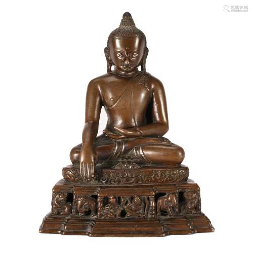 A BRONZE FIGURE OF SEATED SHAKYAMUNI