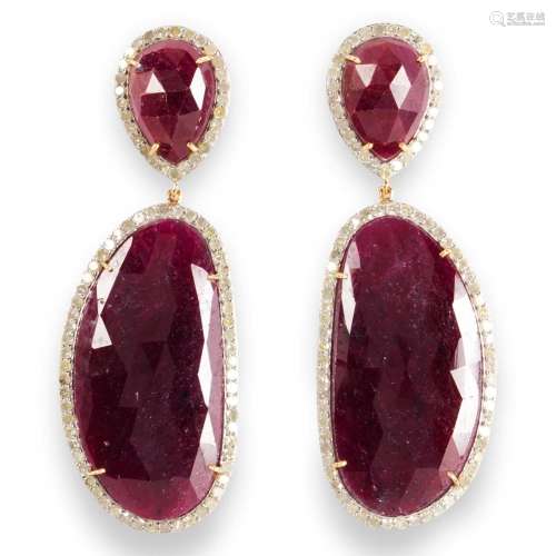 A pair of ruby and diamond pendant earrings