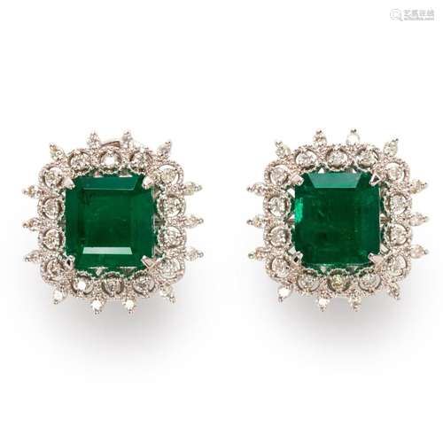 A pair of emerald, diamond and eighteen karat white gold ear...