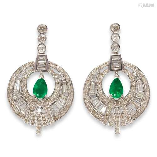 A pair of emerald, diamond and eighteen karat white gold ear...