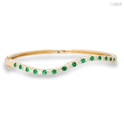 An emerald, diamond and fourteen karat gold bracelet