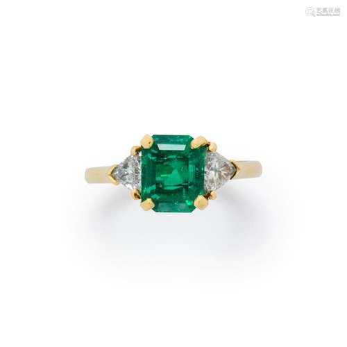 An emerald, diamond and eighteen karat gold ring