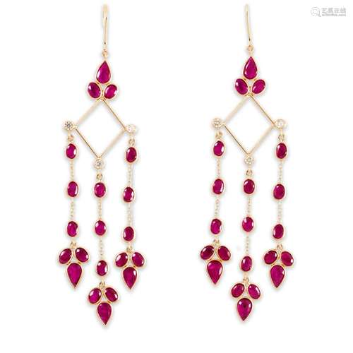 A pair of ruby, diamond and eighteen karat gold earrings