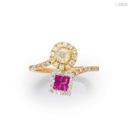 A diamond, ruby and eighteen karat bi-color gold ring