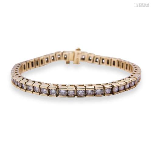 A diamond and fouteen karat gold bracelet