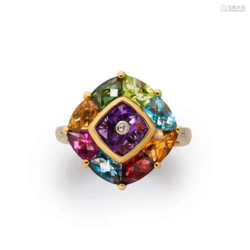 A gemstone and eighteen karat gold ring