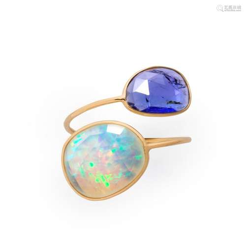 A tanzanite, opal and eighteen karat gold ring