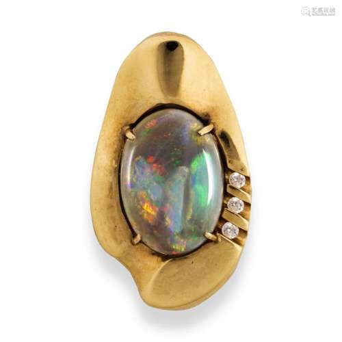 An opal and fourteen karat pendant
