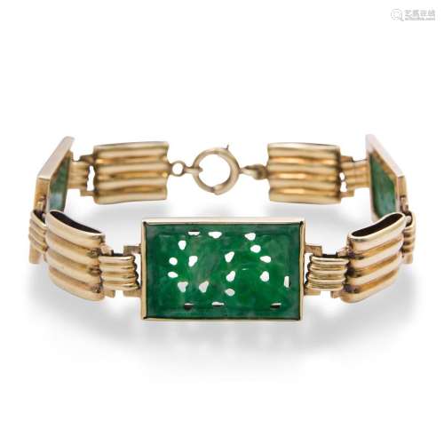 A jade and fourteen karat gold bracelet