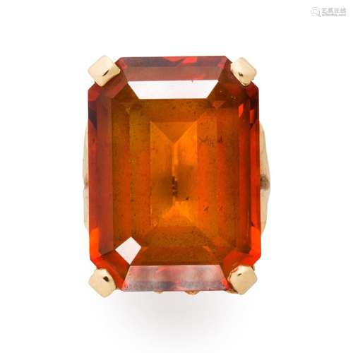 An orange zircon and fourteen karat gold ring