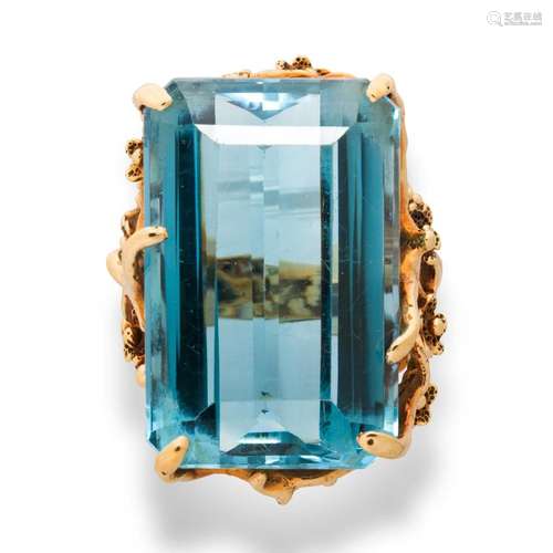 A blue topaz and fourteen karat gold ring