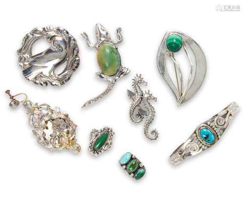 A group of silver jewelry