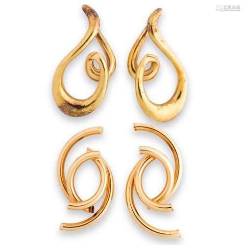 A group of fourteen karat gold earrings