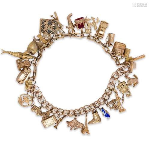 A mostly fourteen karat gold charm bracelet