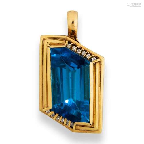 A blue topaz, diamond and fourteen karat gold pendant