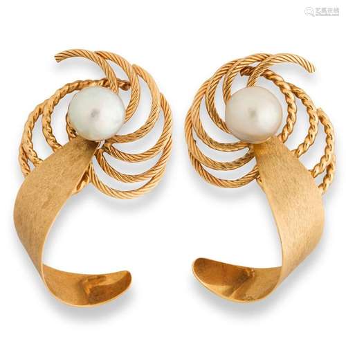 A pair of pearl and fourteen karat gold ear jackets