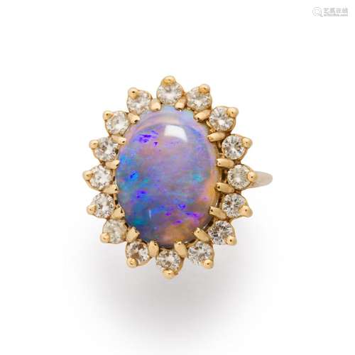 An opal, diamond fourteen karat gold ring