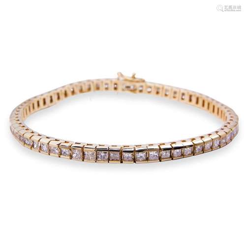 A diamond and fourteen karat gold bracelet