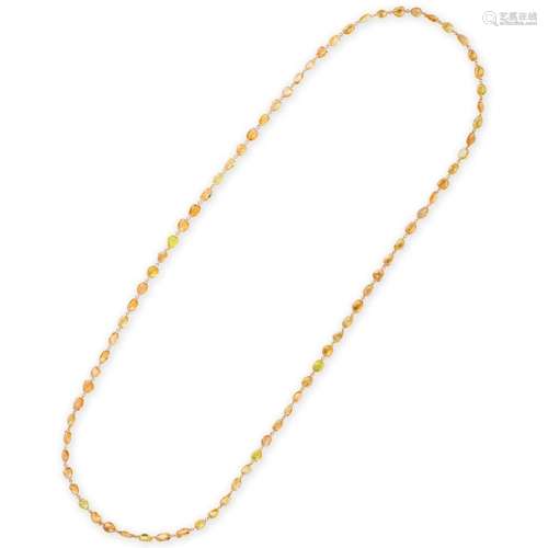 A yellow sapphire and eighteen karat gold necklace