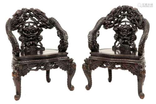 pair of antique Chinese armchairs in richly sculpt…