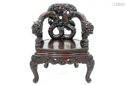 antique Chinese armchair in richly sculpted wood w…